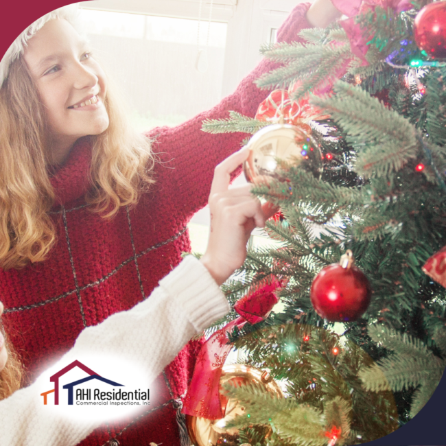 AHI Residential & Commercial Inspections (3) A joyful moment of two young girls wearing Santa hats as they decorate a beautifully lit Christmas tree