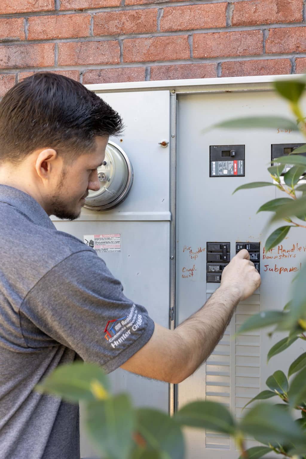home inspector checking the exterior breaker box to see if there are any issues