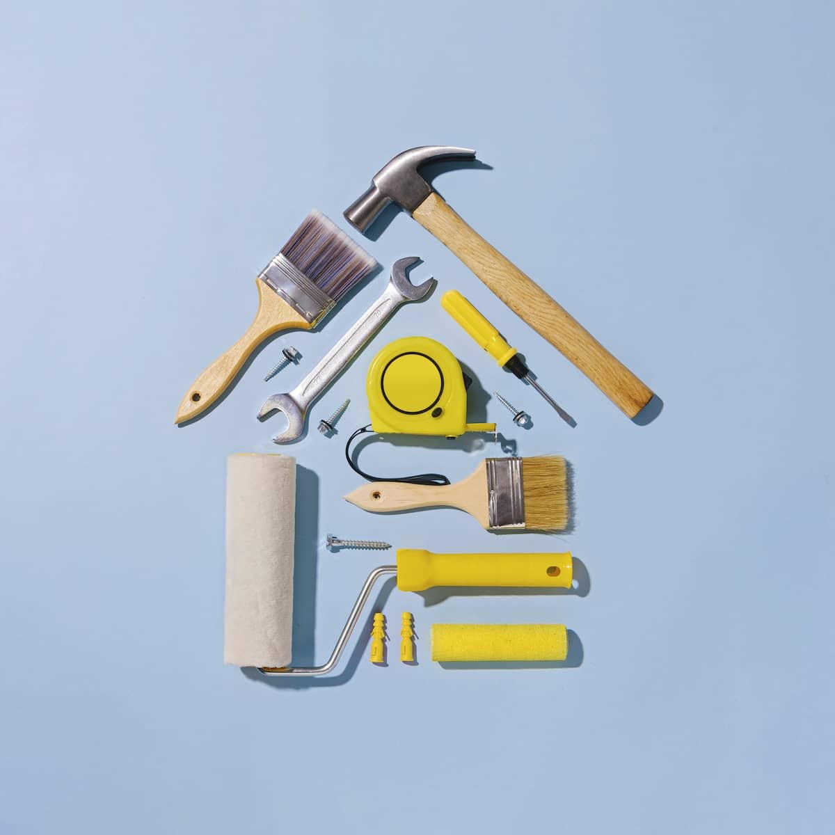 Tools and supplies in the shape of a home to represent home repair estimates in Charlotte NC