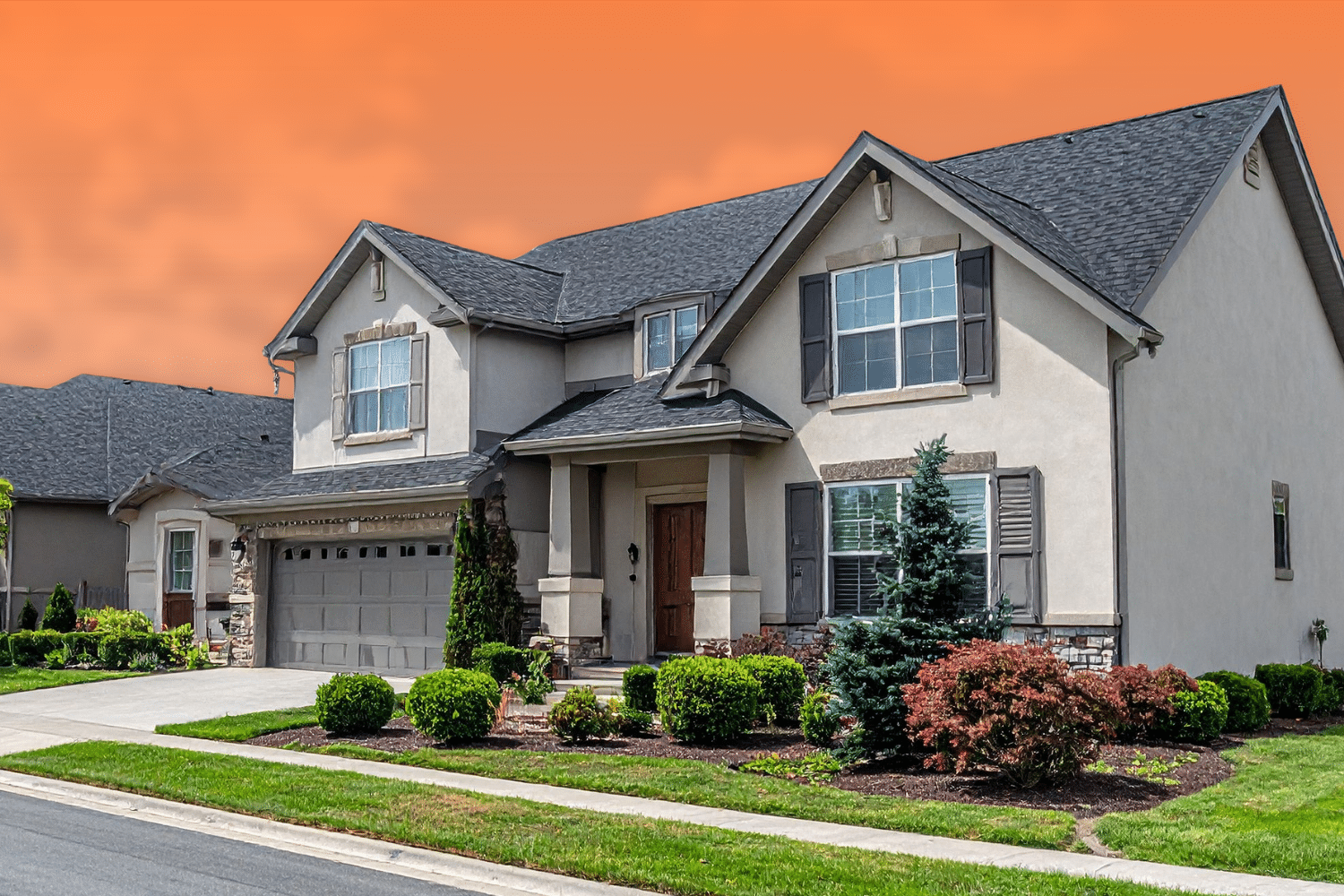 Home 32 Front exterior of a two-story suburban home featuring dark shutters, a two-car garage, and a landscaped yard under an orange sky.