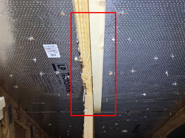 Split and damaged roof truss member in the attic of Home C