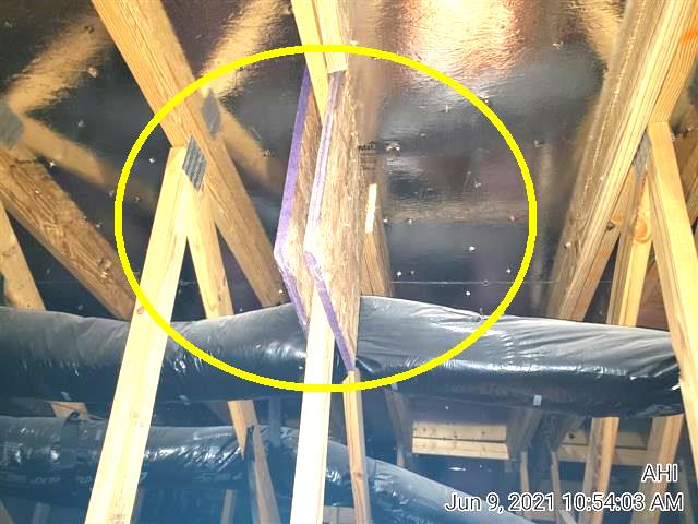 Truss repaired on site with added lumber and no engineer's letter in the attic of Home J