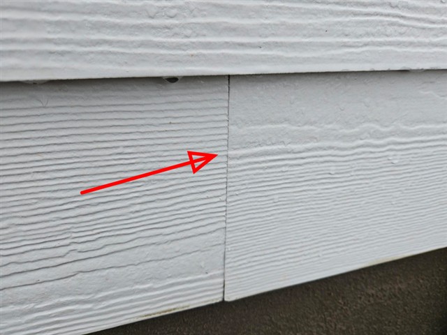 Offset, buckled butt joint in fiber cement siding on Home C