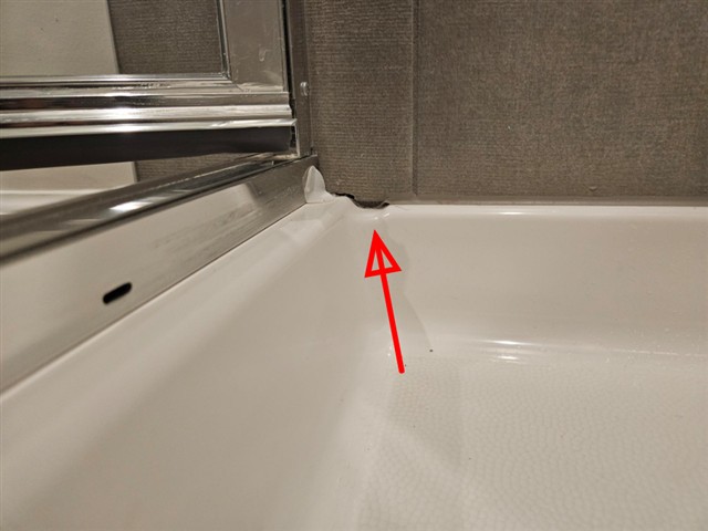 Shower weep holes sealed shut with caulk in Home B