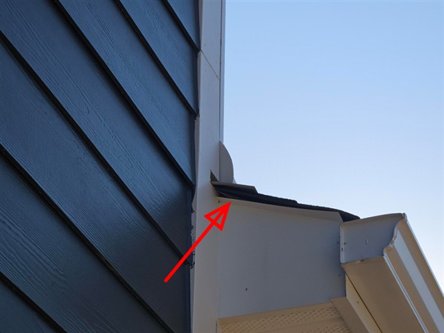 Bent, cut-short metal fascia wrap on Home D