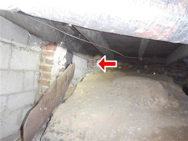 Home C: a brick pier leaning and unstable in the crawl space