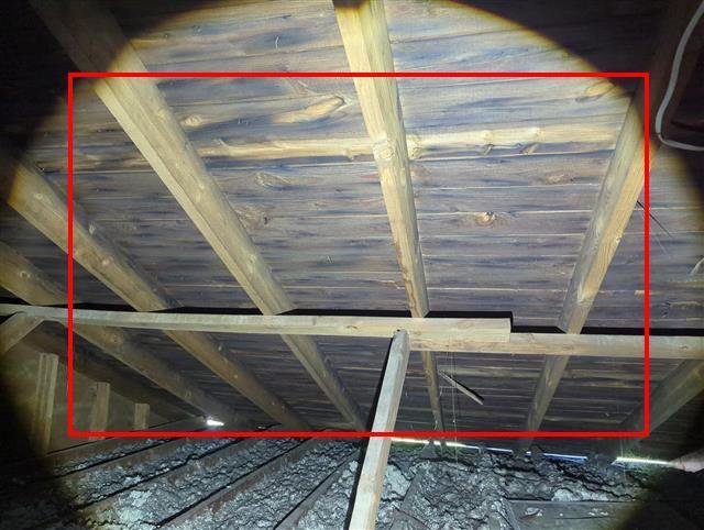 Home I: dark staining on the roof sheathing from poor attic ventilation