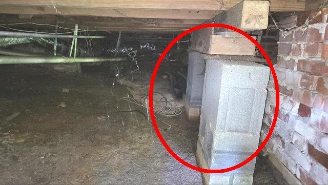Home I: an added block pier installed incorrectly under a drop girder