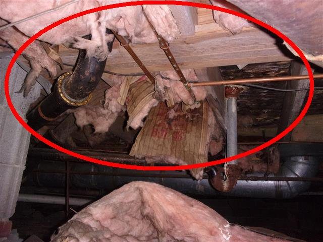 Home J: crawl space insulation torn down and hanging loose