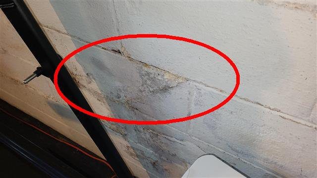 Home H: water stains on the basement wall