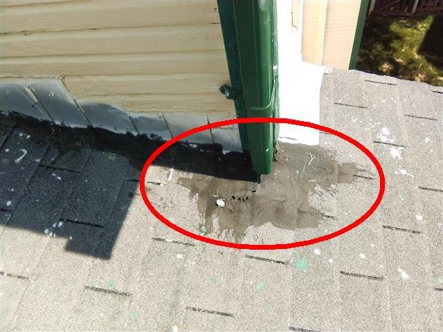 Home D: tar patching where the rear addition meets the original roof