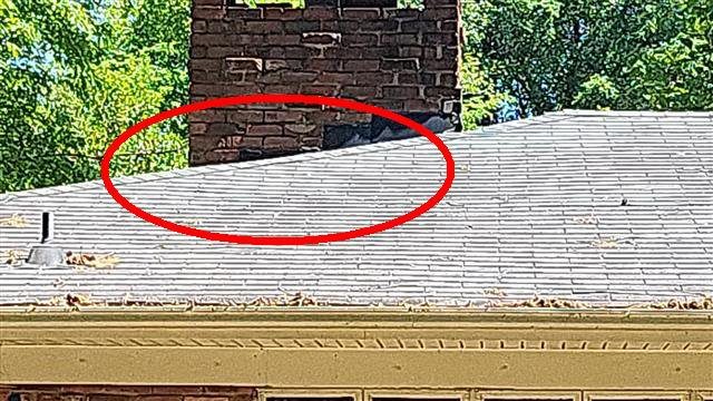 Home H: failing shingle tabs, with leak signs in the kitchen below