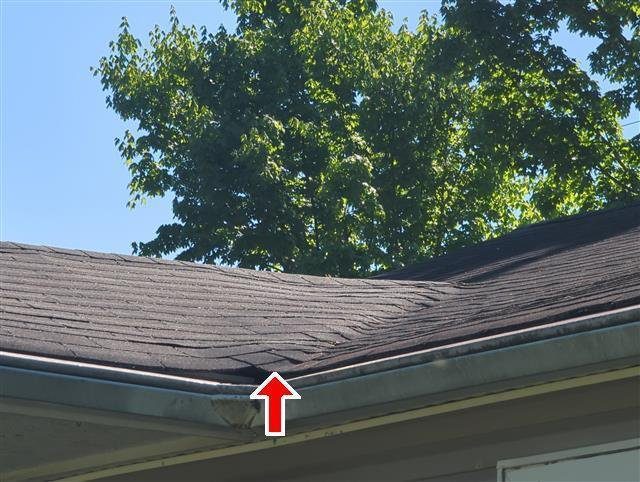 Home I: shingles at the end of their service life, installed over an older layer
