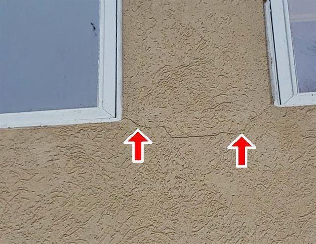 Home F: cracks in the EIFS below the windows