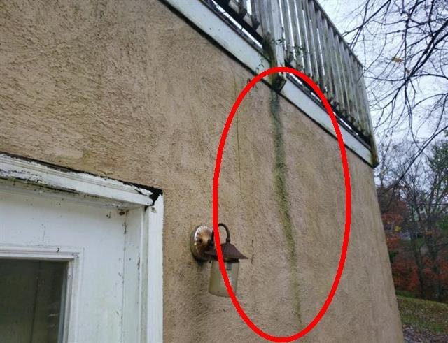Home F: water intrusion and damage in the boat house stucco