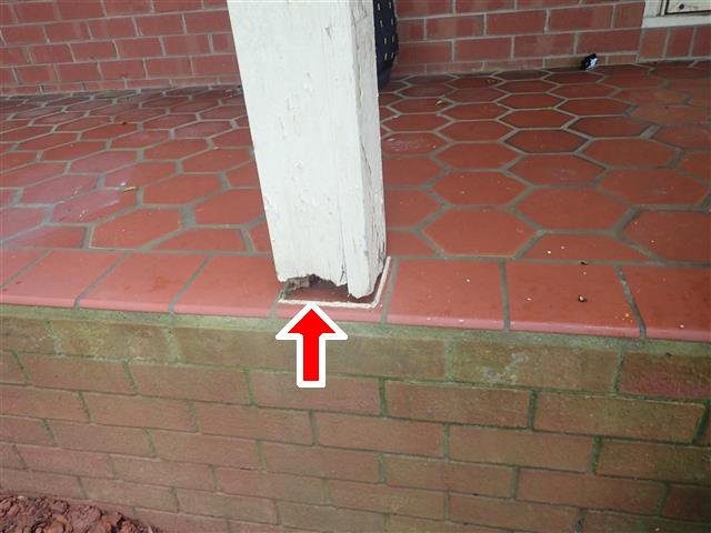 Home G: a porch post rotted at the base