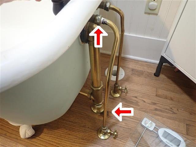 Home D: an active leak at the tub supply line, damaging the wall and floor