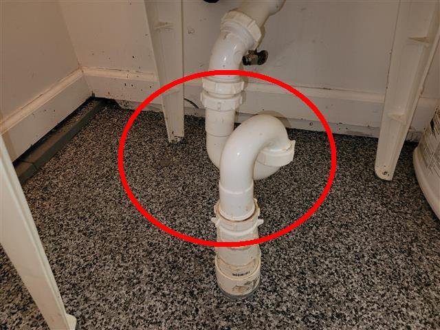 Home A: an S-trap at the garage bathroom sink