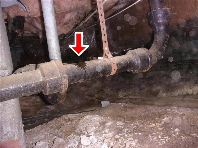 Home J: a leaking tub drain in the crawl space
