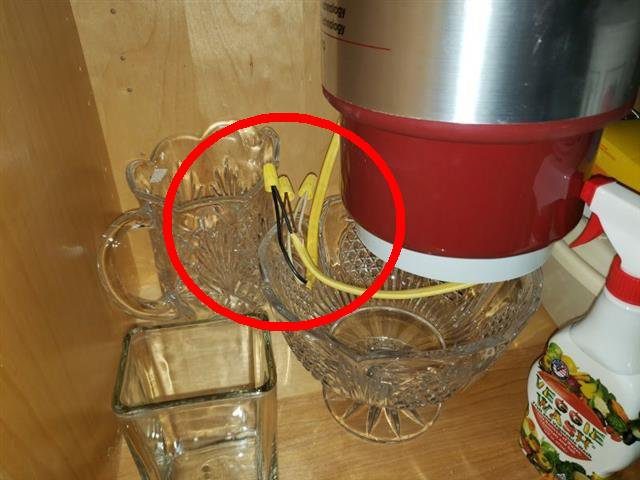 Home E: an open splice and exposed wiring at the disposal