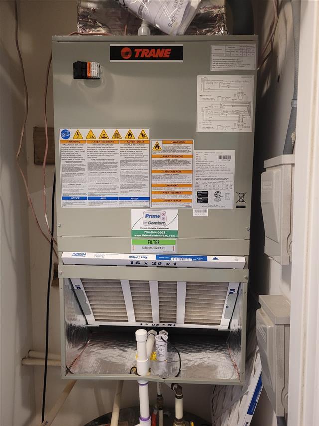 Trane air handler with filter in a condo utility closet