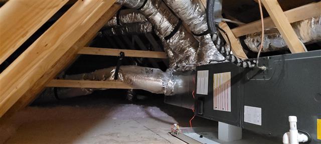 Brand New Doesn't Mean Problem-Free: A Gastonia New Construction Home Inspection 15 New HVAC air handler and insulated flex ductwork in the attic of a new construction home