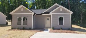 New construction ranch home with gray vinyl siding in Gastonia, NC before its home inspection