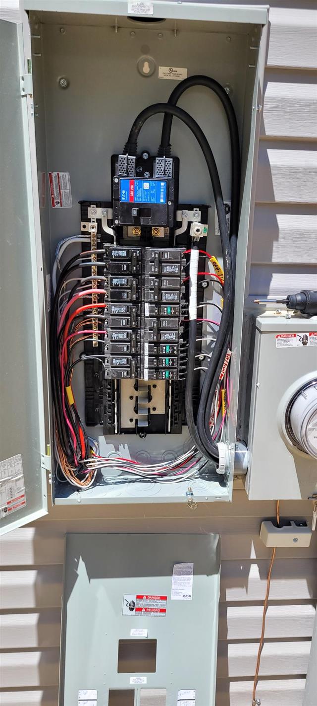Brand New Doesn't Mean Problem-Free: A Gastonia New Construction Home Inspection 16 New exterior main electrical panel with the cover removed during a home inspection in Gastonia
