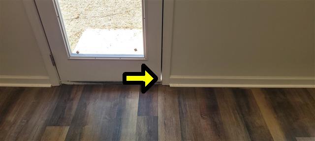 Brand New Doesn't Mean Problem-Free: A Gastonia New Construction Home Inspection 13 Unpainted entry door trim at the floor of a new construction home